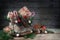 Old hiking boots filled with sweets, gifts and Christmas decoration on Nicholas day, or German Nikolaus Tag, on the 6th December