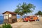 Old hippie minivan on the background of rocks, wood and the Mediterranean