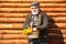 Old hipster man with flowers. Portrait of aged man with beard. Happy man with beard and mustache hold basket of flowers