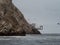 Old historic abandoned bridge ruins at Islas Ballestas Islands pacific ocean rock formation peruvian booby Paracas Peru