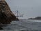 Old historic abandoned bridge ruins at Islas Ballestas Islands pacific ocean rock formation peruvian booby Paracas Peru