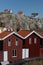 Old historic fishing storage houses in SmÃ¶gen town with waterfront in SotenÃ¤s, VÃ¤stra GÃ¶taland, Sweden on a sunny day