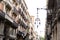 Old historic houses with windows, balconies and streetlight in Barcelona