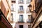 Old historic houses with windows, balconies and streetlight in Madrid