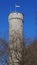 Old historic massive tower in Tallinn (Estonia) with flag