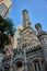 Old, historic, original Chicago city water tower building with castle architecture under blue sky