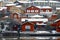 Old historic Porvoo, Finland with Traditional Scandinavian rural red wooden houses under white snow. Snowing