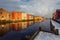 Old historic storehouses along the river Nidelva with colorful painted facades in Trondheim on beautiful winter day