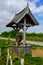 Old historic well standing at the road