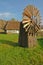 Old historic windmill against cottages