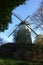 Old historic windmill in a blue sky scenic setup . Windmill in opencast museum Kommern in Germany