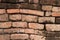 Old historical Asian red brick wall background close up