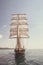 Old historical ship yacht with white sails, sailing in the sea