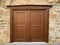 An old historical stone wall with a wooden door in Antalya Old town Kaleici, Turkey. Ottoman time architecture. Horizontal photo