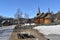 Old Hol Gamle Kyrkje church building stands in the countryside, near a winding road