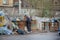 Old homeless man rummages in the dustbin in Voronezh trash