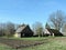 Old homestead in village in spring, Lithuania