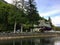 An old hotel beside the ocean surrounded by tall evergreen trees in British Columbia, Canada