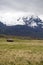 Old house below a glacier capped volcano in the Antisana Ecological Reserve, Ecaudor