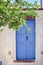 Old house and blue door at Emporio village of