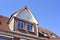 Old house with dormer and blue sky