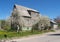 Old house of the German construction with the blossoming apple-trees. Kaliningrad