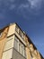 old house with glazed balconies against the sky