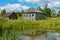 Old house on the shore of the old pond