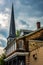 An old house and steeple of a chuch in Ellicott City, Maryland.