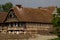 An old house with storck on the roof.