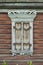 Old house vintage carved windows with wooden lacy shutters close up