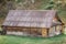 Old house with walls lined with firewood