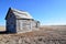 Old house on winter prairie