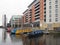 Old houseboats moored alongside modern apartment buildings in leeds dock in west yorkshire