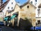 Old houses and architecture in a German city, Europe. Small shops and cars near them