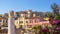 Old houses in Athens, famous Acropolis in distance, Greece. Beautiful scenic view of Plaka district in Athens city center