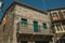 Old houses and balcony with wrought iron railing