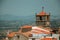 Old houses and church steeple with clock at Monsanto