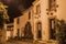 Old houses with flowered shrubs at dusk in Marvao