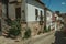 Old houses with flowering pots and deserted alley