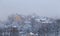 Old houses on a hill in Stockholm on a foggy winter day with snow on, Sweden