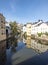 Old houses reflect in water of river alzette in grund or lower town of luxembourg city