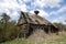 Old houses and sheds with a roof covered with reeds using old-fashioned technology in the Polesie