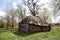 Old houses and sheds with a roof covered with reeds using old-fashioned technology in the Polesie