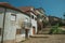 Old houses in small square on slope with steps