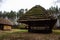 Old houses with thatched roof. Village with ancient houses. Background. Autumn landscape.