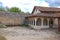 Old houses with tiled roofs. View from the yard. Chufut Kale, a cave city in Crimea from the 5th century