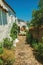 Old houses with whitewashed wall in an alley