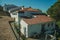 Old houses with whitewashed wall over rocks in Marvao