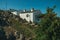 Old houses with whitewashed wall over rocks in Marvao